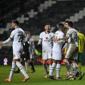 MK Dons celebrate Regan Poole's goal against Norwich