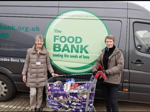 Helathcare staff donated 64 selection boxes to MK Foodbank