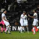 Dons celebrate Cameron Jerome's goal