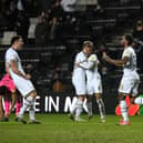 Dons celebrate Cameron Jerome's goal