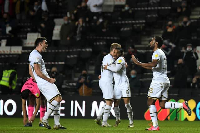 Dons celebrate Cameron Jerome's goal