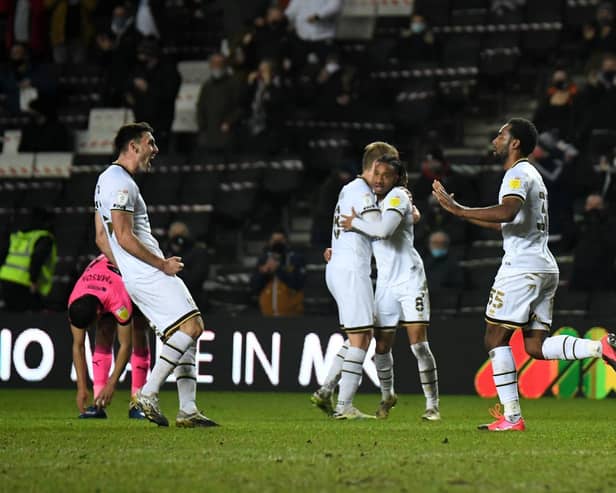 Dons celebrate Cameron Jerome's goal