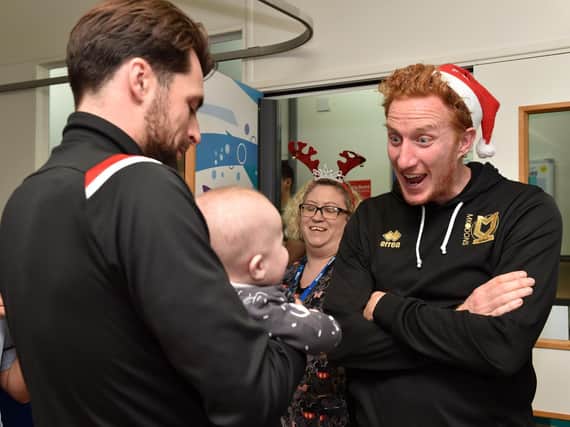 Russell Martin and Dean Lewington at the children's ward in 2019