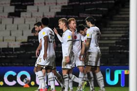 Dons celebrate after scoring against Bristol Rovers