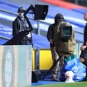 Referee Jonathan Moss checks an incident on the monitors