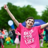 Cancer survivor Sarah Wilson celebrating at a previous Race for Life event before coronavirus related cancellations in 2020