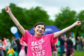 Cancer survivor Sarah Wilson celebrating at a previous Race for Life event before coronavirus related cancellations in 2020