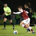 David Kasumu battles in midfield against Northampton