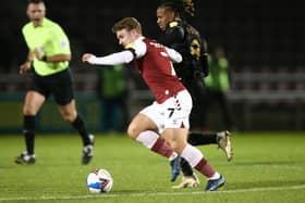 David Kasumu battles in midfield against Northampton