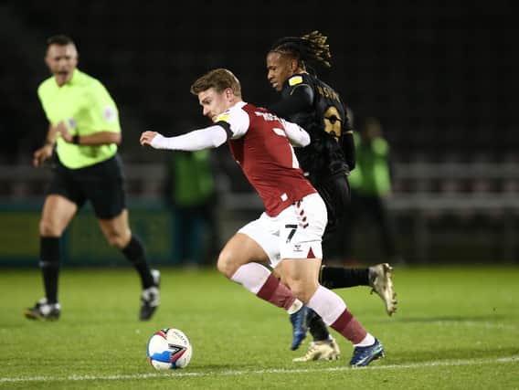 David Kasumu battles in midfield against Northampton