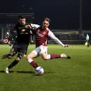 Regan Poole battles at the back against Northampton Town