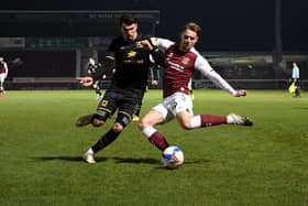Regan Poole battles at the back against Northampton Town