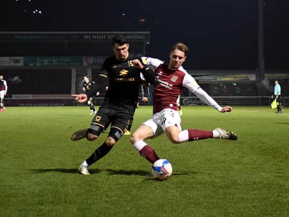Regan Poole battles at the back against Northampton Town