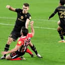 Warren O'Hora scraps with Will Grigg