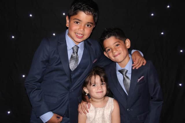 Shay with his younger brother and sister