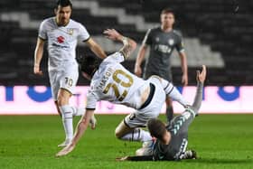 Joe Mason is upended by Paul Coutts