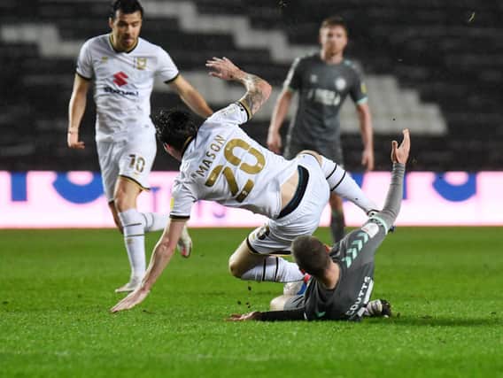 Joe Mason is upended by Paul Coutts
