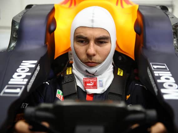 Sergio Perez gets accustomed to his new Red Bull Racing cockpit