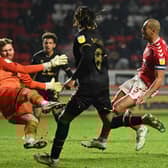 Andrew Fisher in action for MK Dons at Charlton earlier this season