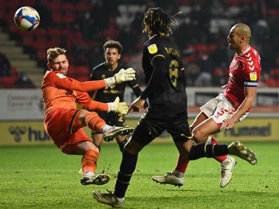 Andrew Fisher in action for MK Dons at Charlton earlier this season