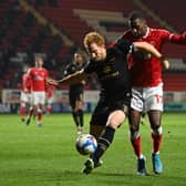 Dean Lewington defends against Charlton