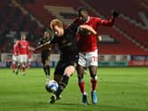 Dean Lewington defends against Charlton