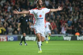 Will Grigg scored twice against Manchester United in the 4-0 win