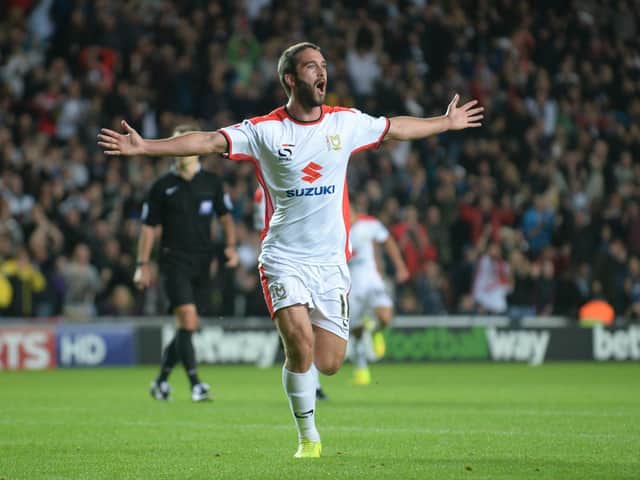 Will Grigg scored twice against Manchester United in the 4-0 win