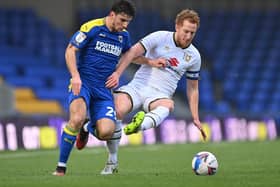 Dean Lewington throws himself into a tackle