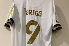 Will Grigg's new Dons shirt