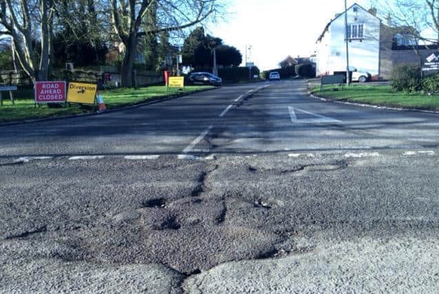 This photo of the road at the centre of Newton Longville is among the worst potholes in Milton Keynes