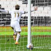 Charlie Brown celebrates his first Dons goal - the winner against Northampton