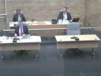As the YouTube broadcast was switched off Cllr Marland, left, and mayor Andrew Geary (top centre) were continuing their 'discussion'