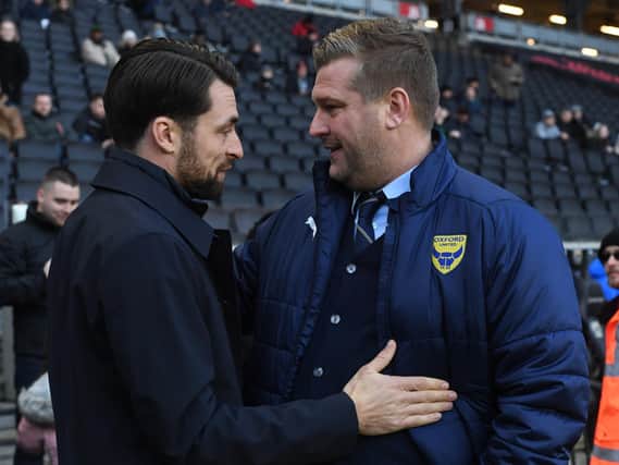 Russell Martin and Karl Robinson when the sides met last season