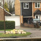 A pile of sandbags awaits more heavy rain