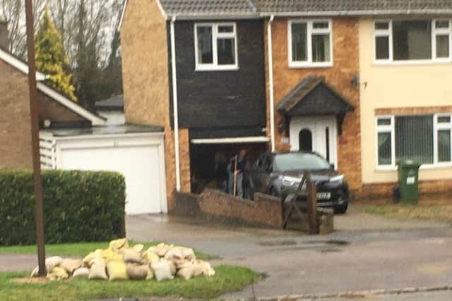 A pile of sandbags awaits more heavy rain