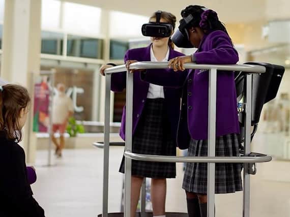 Schoolgirls try out virtual reality headsets at a previous MK STEM festival in Middleton Hall. This year's event is online only and begins on Monday at 9am