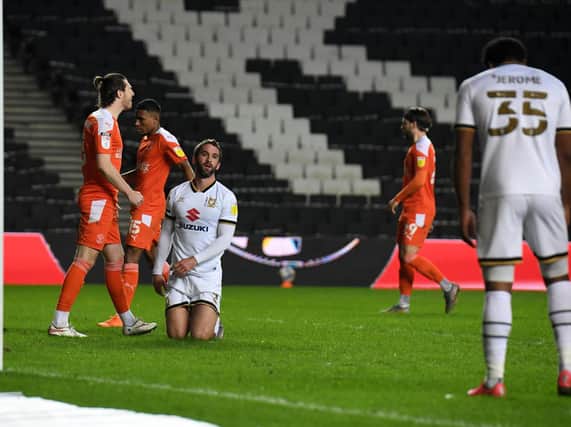 Will Grigg came close to converting after Cameron Jerome's effort hit the bar