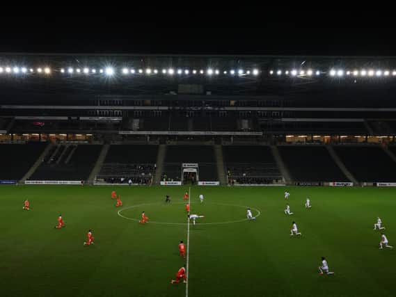 MK Dons warmed up and kicked towards the opposite end in the first half against Blackpool to where they usually do