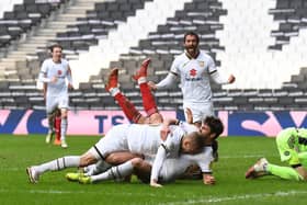 Dons celebrate Matt O'Riley's stoppage-time winner