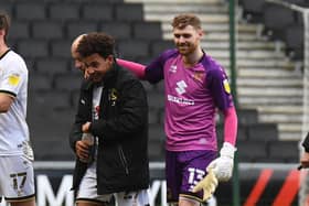 Matthew Sorinola is congratulated by keeper Andrew Fisher after being Accrington