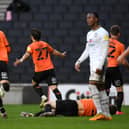 Oxford's Elliot Lee celebrates his late equaliser against Dons