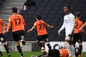 Oxford's Elliot Lee celebrates his late equaliser against Dons