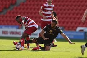 Carlton Morris goes in for a challenge against Doncaster Rovers