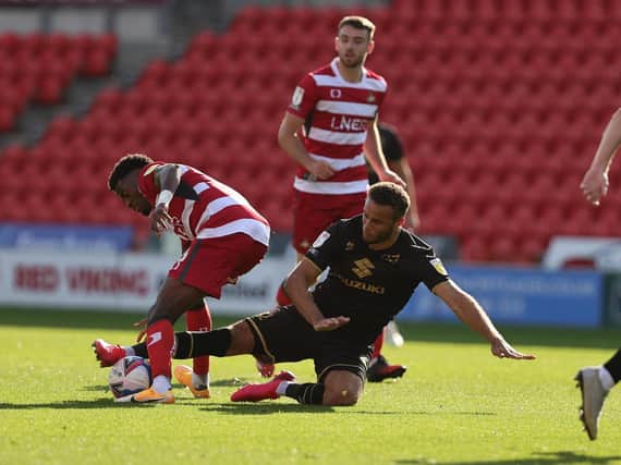 Carlton Morris goes in for a challenge against Doncaster Rovers