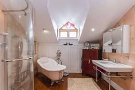 The master bedroom is fitted with a dressing area and luxurious four piece bathroom.