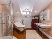 The master bedroom is fitted with a dressing area and luxurious four piece bathroom.