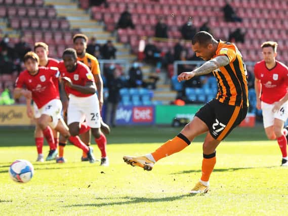 Josh Magennis fired home a penalty for Hull in their win over Crewe
