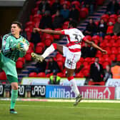 Lee Nicholls gathers ahead of Doncaster's Cameron John