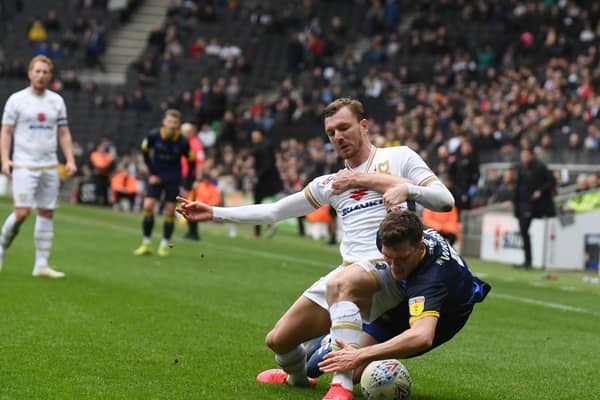 Alex Gilbey takes the tackle against Doncaster